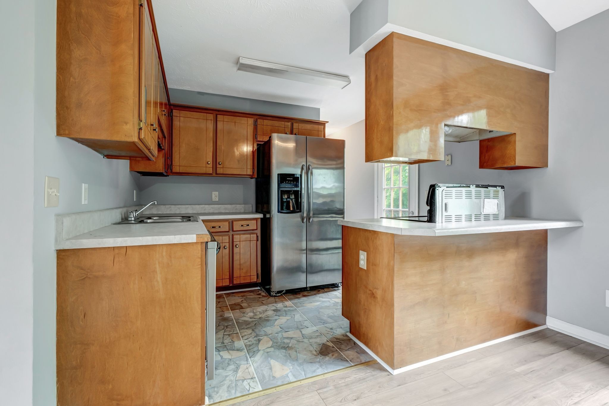 609 Big Riv Run Antioch, TN 37013 - Photo 11 of 24 a kitchen with a refrigerator and a sink