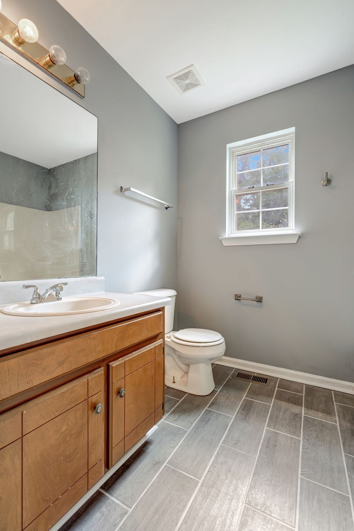 609 Big Riv Run Antioch, TN 37013 - Photo 13 of 24 a bathroom with a toilet sink and mirror