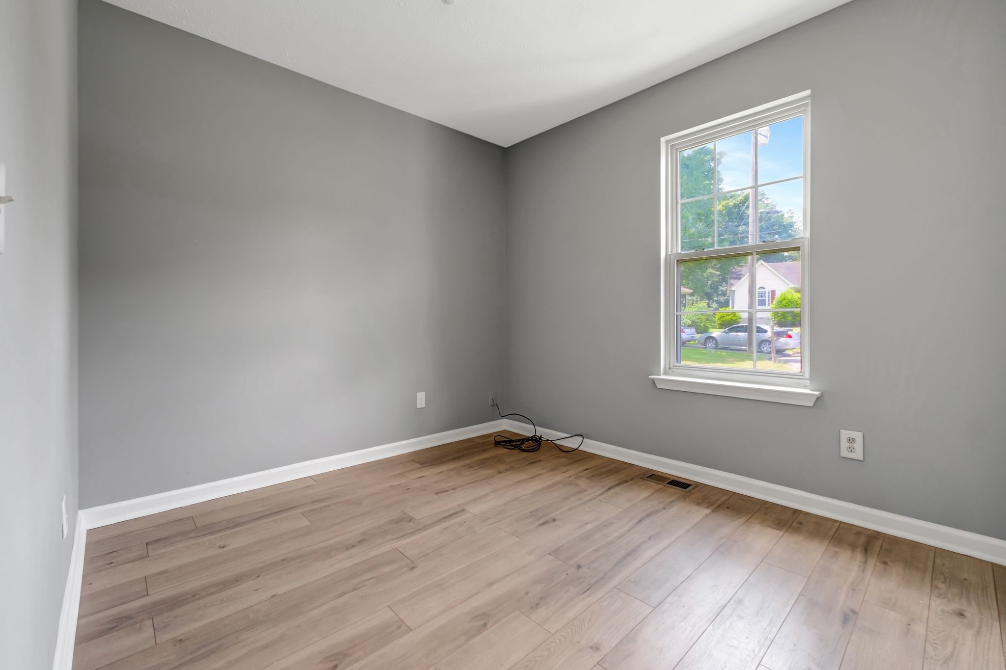 609 Big Riv Run Antioch, TN 37013 - Photo 16 of 24 an empty room with wooden floor and windows