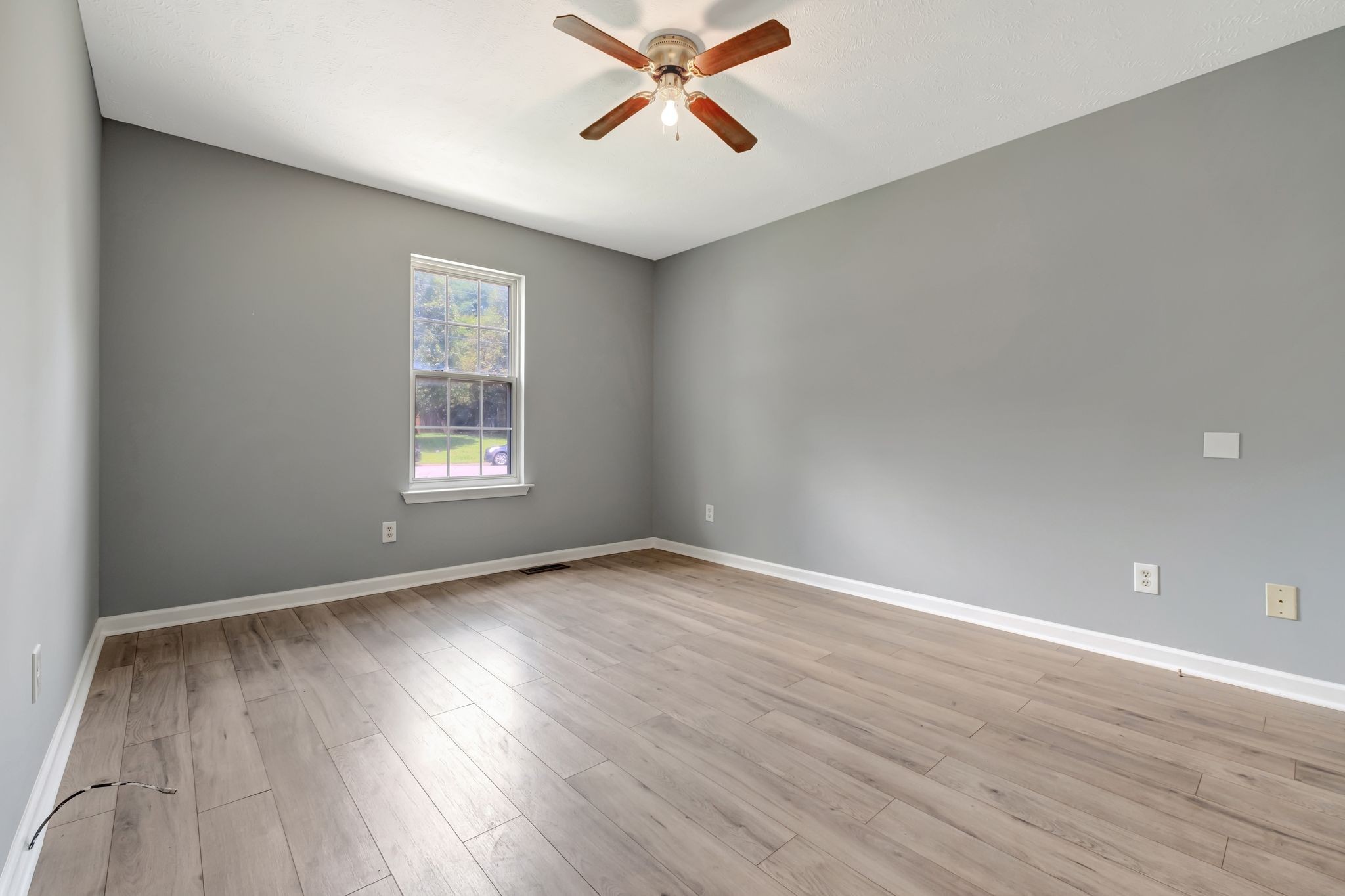 609 Big Riv Run Antioch, TN 37013 - Photo 18 of 24 wooden floor in an empty room with a window