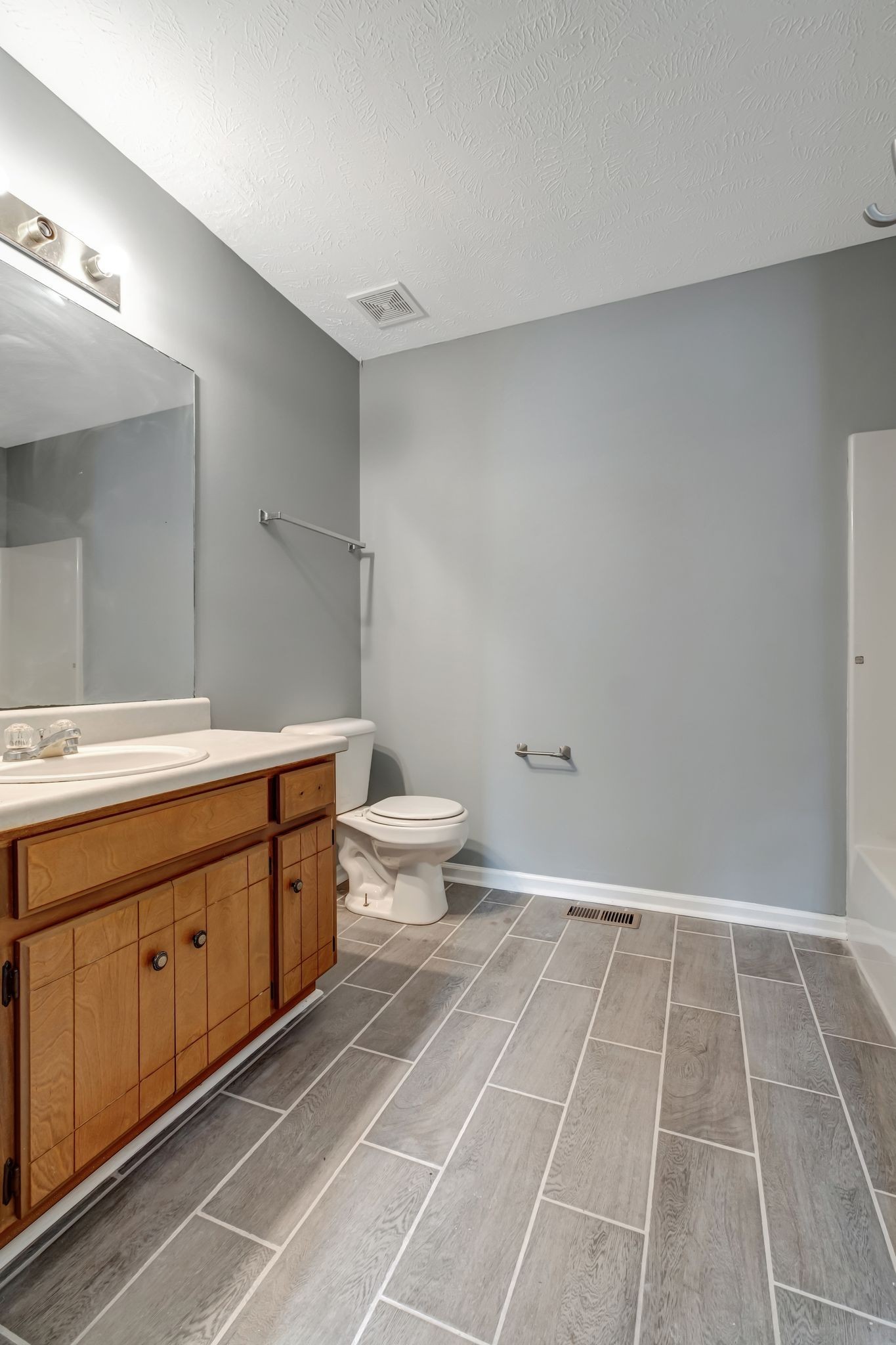 609 Big Riv Run Antioch, TN 37013 - Photo 20 of 24 a bathroom with a sink a toilet and a mirror