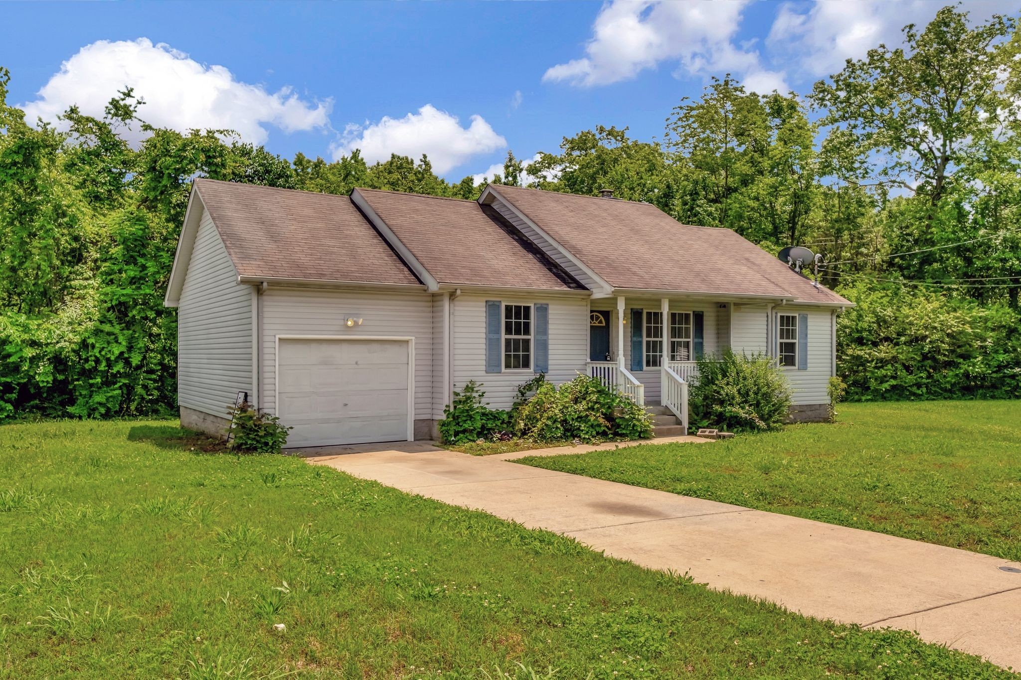 609 Big Riv Run Antioch, TN 37013 - Photo 3 of 24 a front view of a house with a garden
