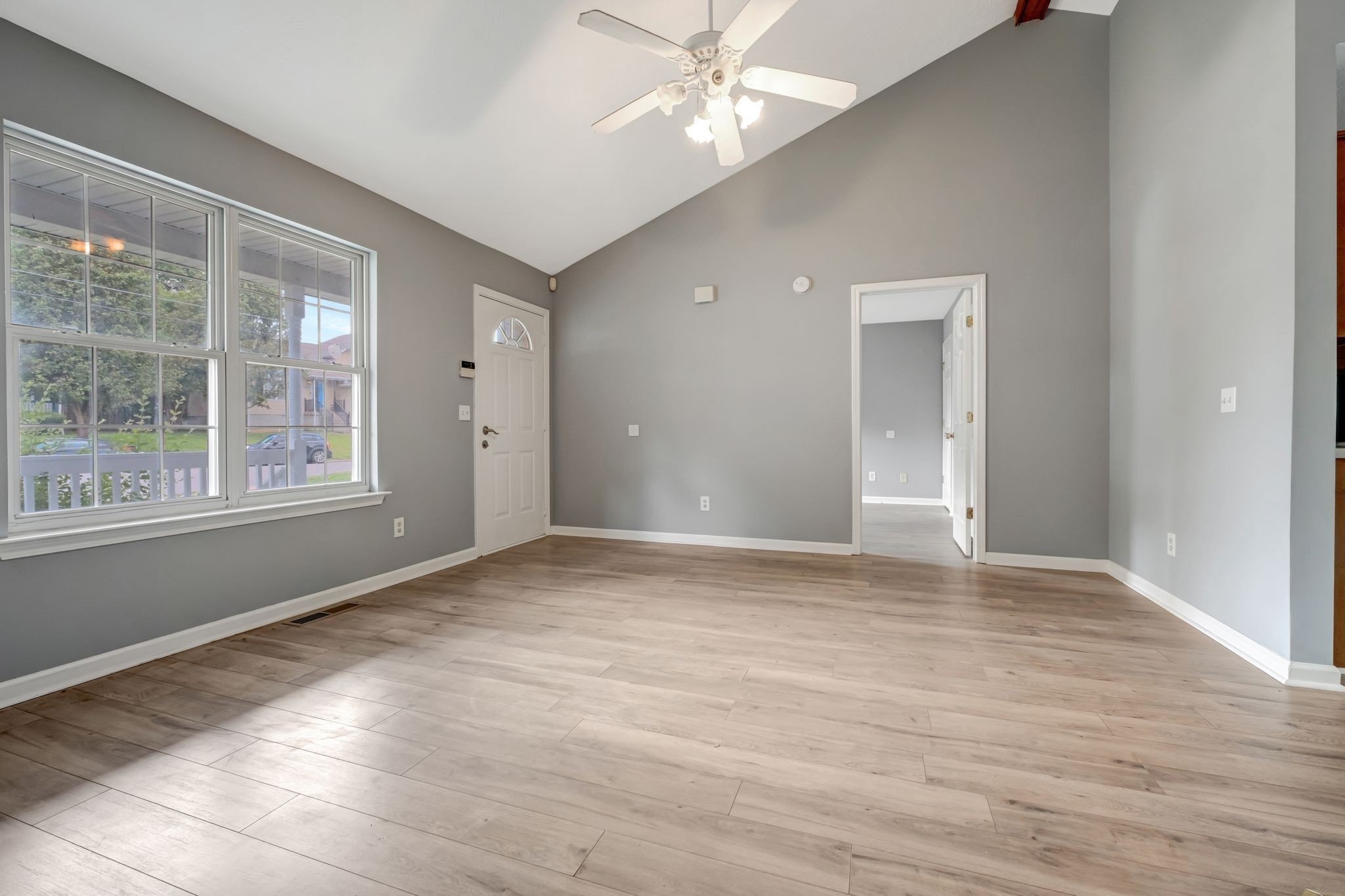 609 Big Riv Run Antioch, TN 37013 - Photo 6 of 24 a view of an empty room with window and wooden floor