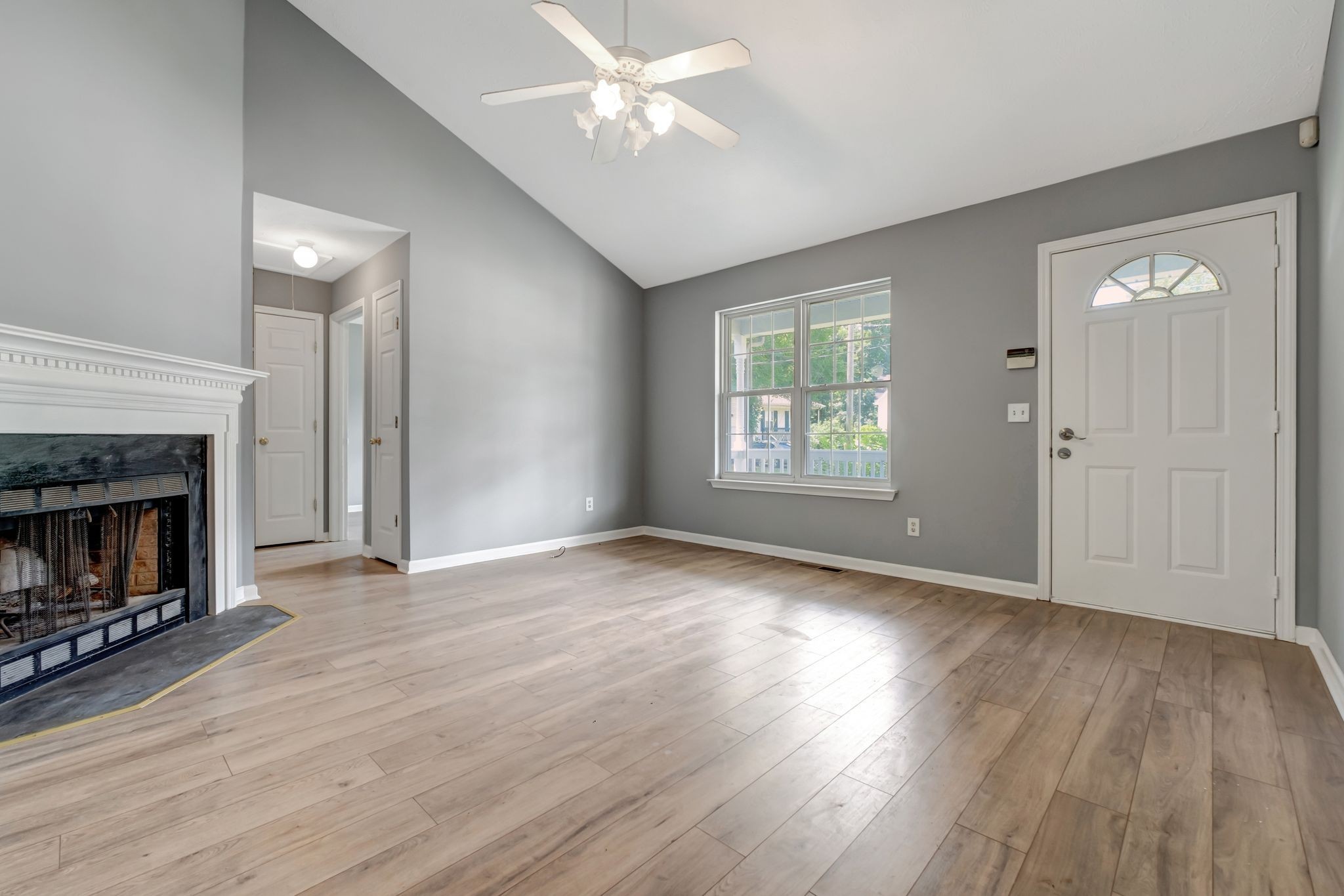 609 Big Riv Run Antioch, TN 37013 - Photo 8 of 24 a view of empty room with wooden floor and fireplace