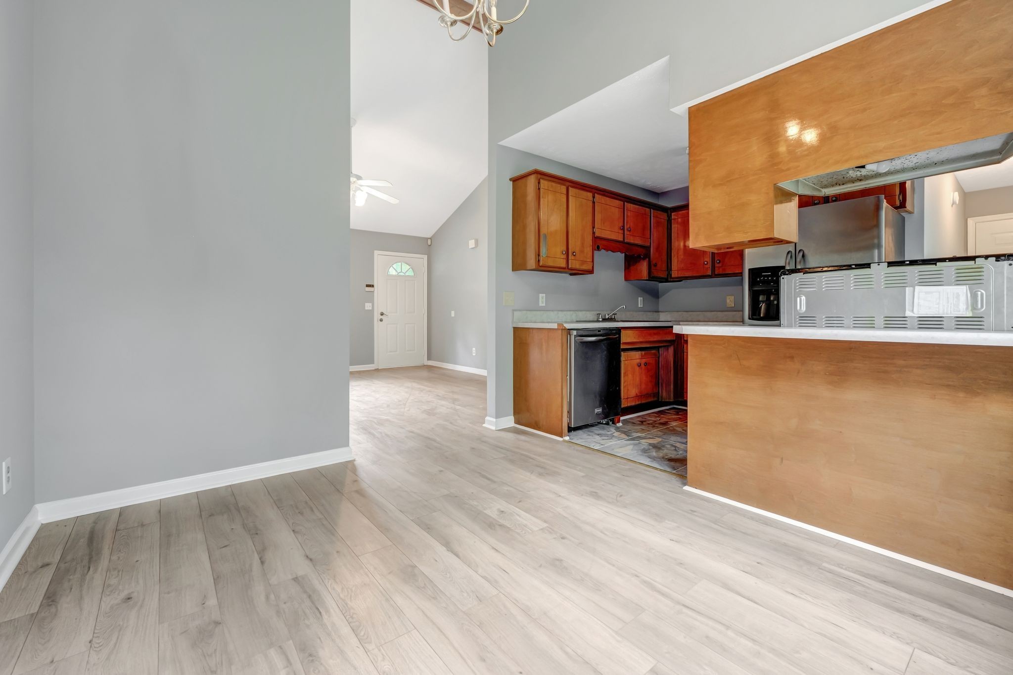 609 Big Riv Run Antioch, TN 37013 - Photo 10 of 24 a view of kitchen with stainless steel appliances wooden floor and a window
