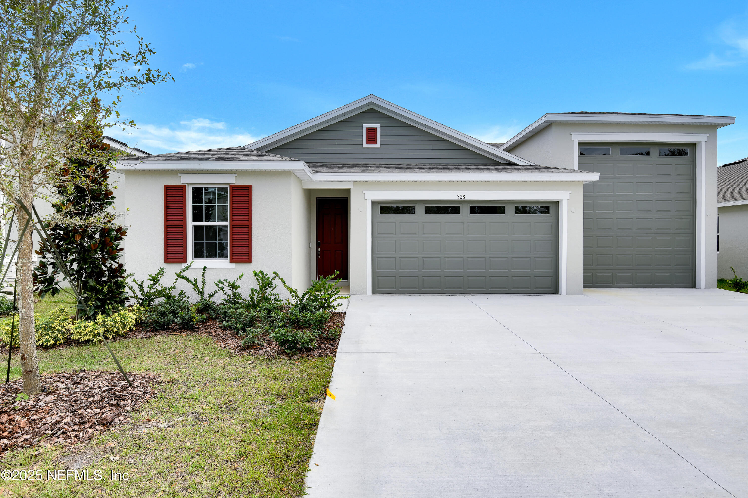 328 Alexandrite Street DeLand, FL 32720 - Photo 1 of 16 a front view of a house with garden