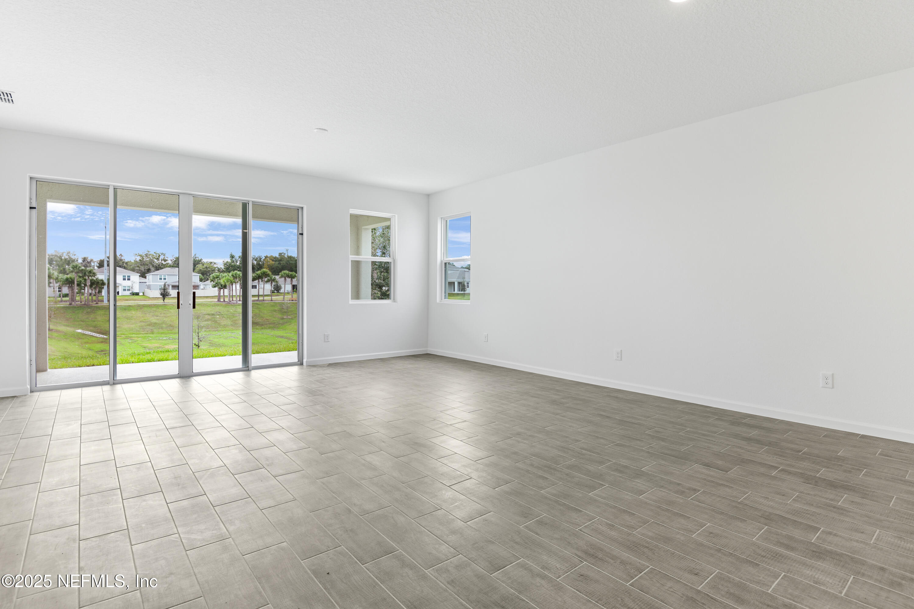 328 Alexandrite Street DeLand, FL 32720 - Photo 12 of 16 a view of an empty room with a window