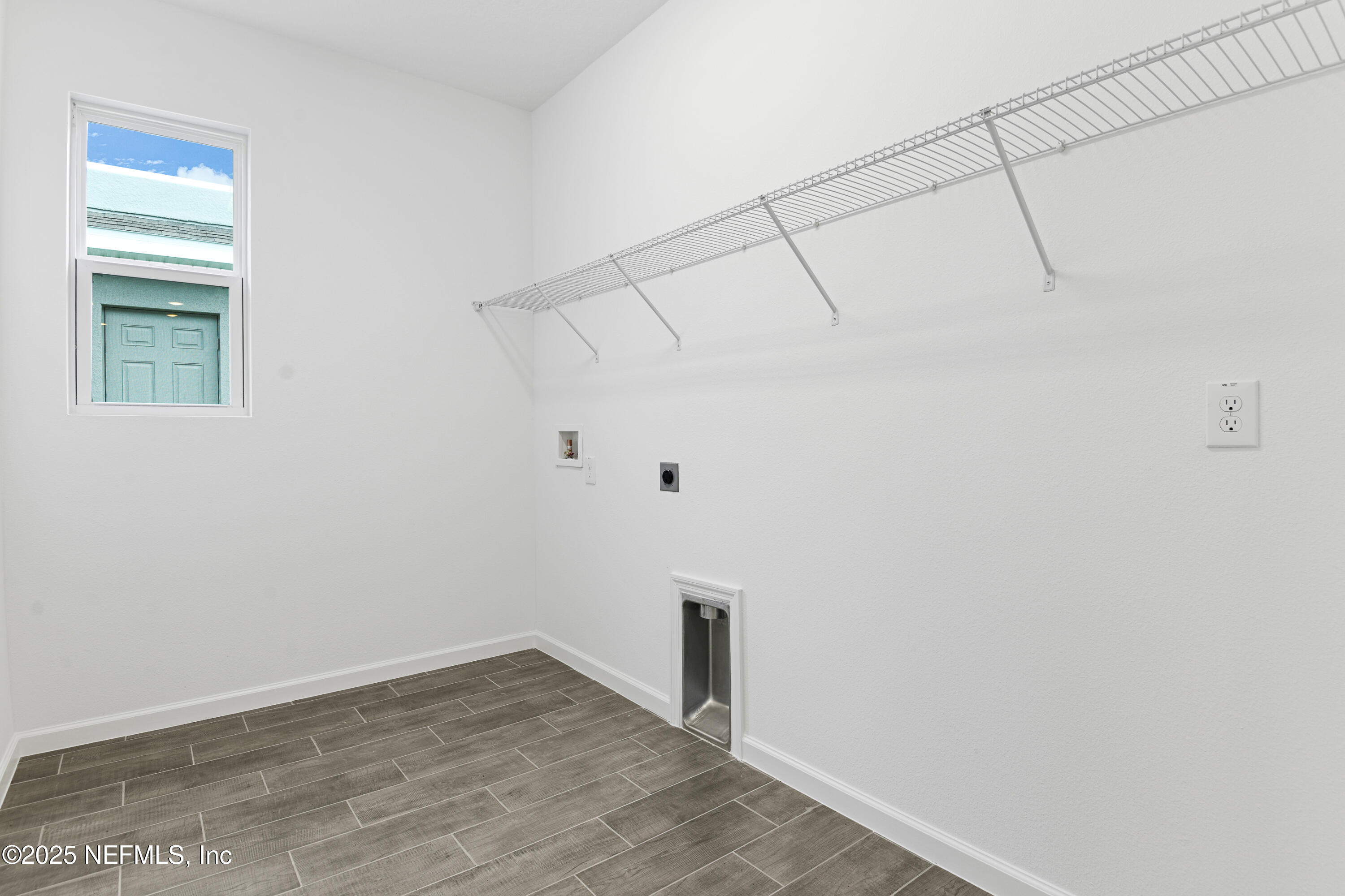 328 Alexandrite Street DeLand, FL 32720 - Photo 14 of 16 a view of a room with wooden floor