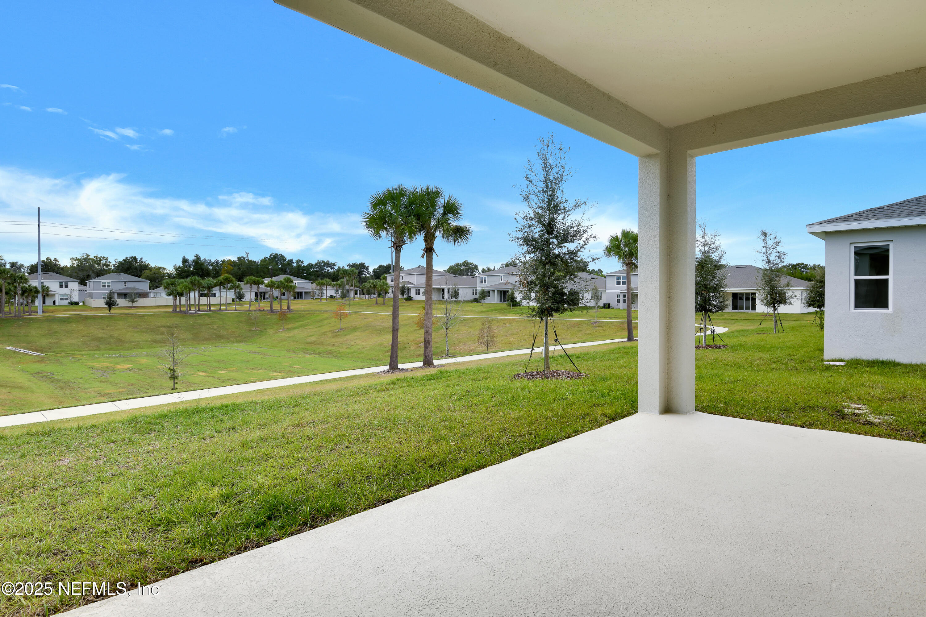 328 Alexandrite Street DeLand, FL 32720 - Photo 15 of 16 a view of a golf course with a lake