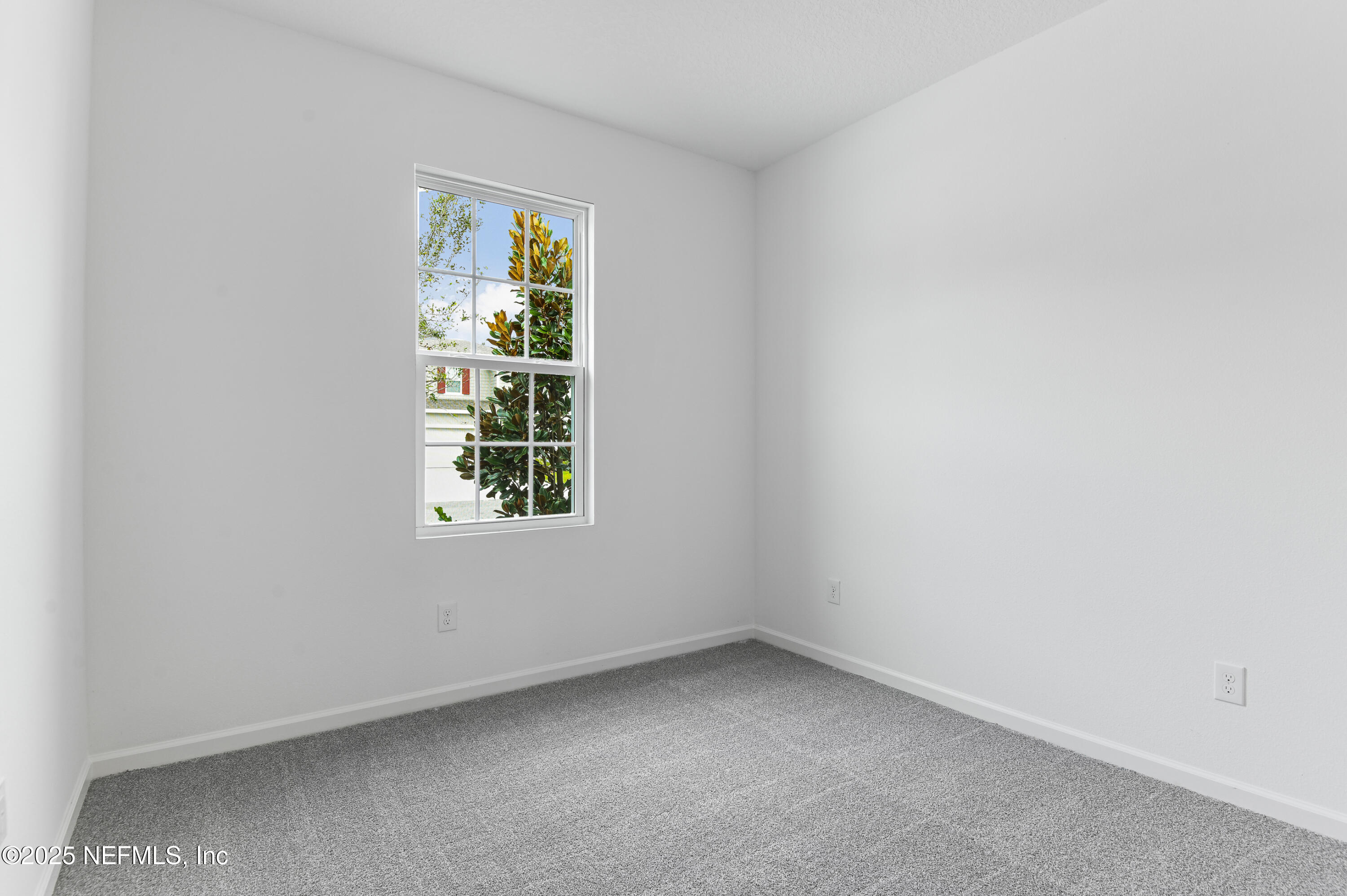 328 Alexandrite Street DeLand, FL 32720 - Photo 4 of 16 an empty room with a window