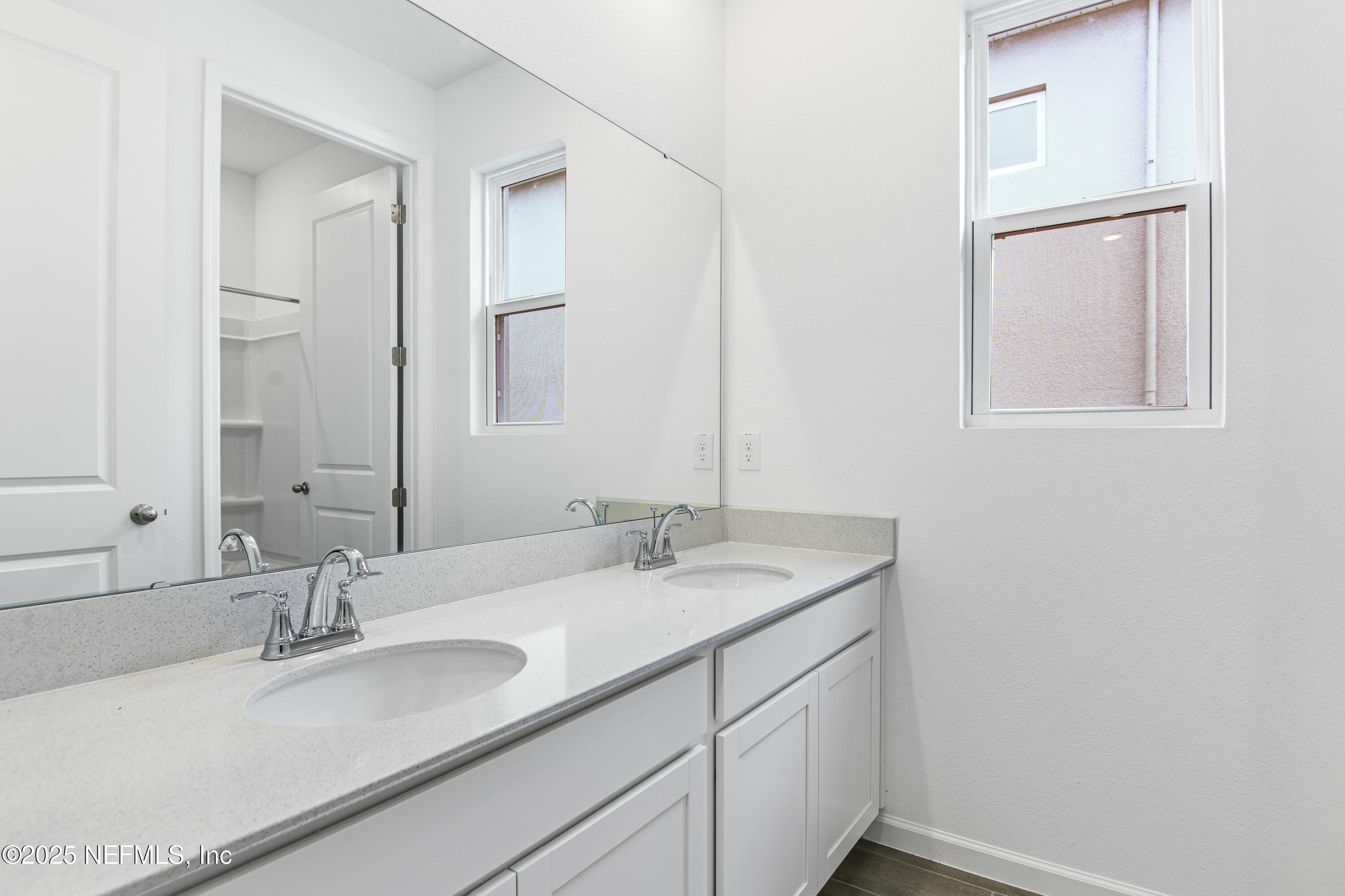 328 Alexandrite Street DeLand, FL 32720 - Photo 5 of 16 a bathroom with a granite countertop sink and a mirror