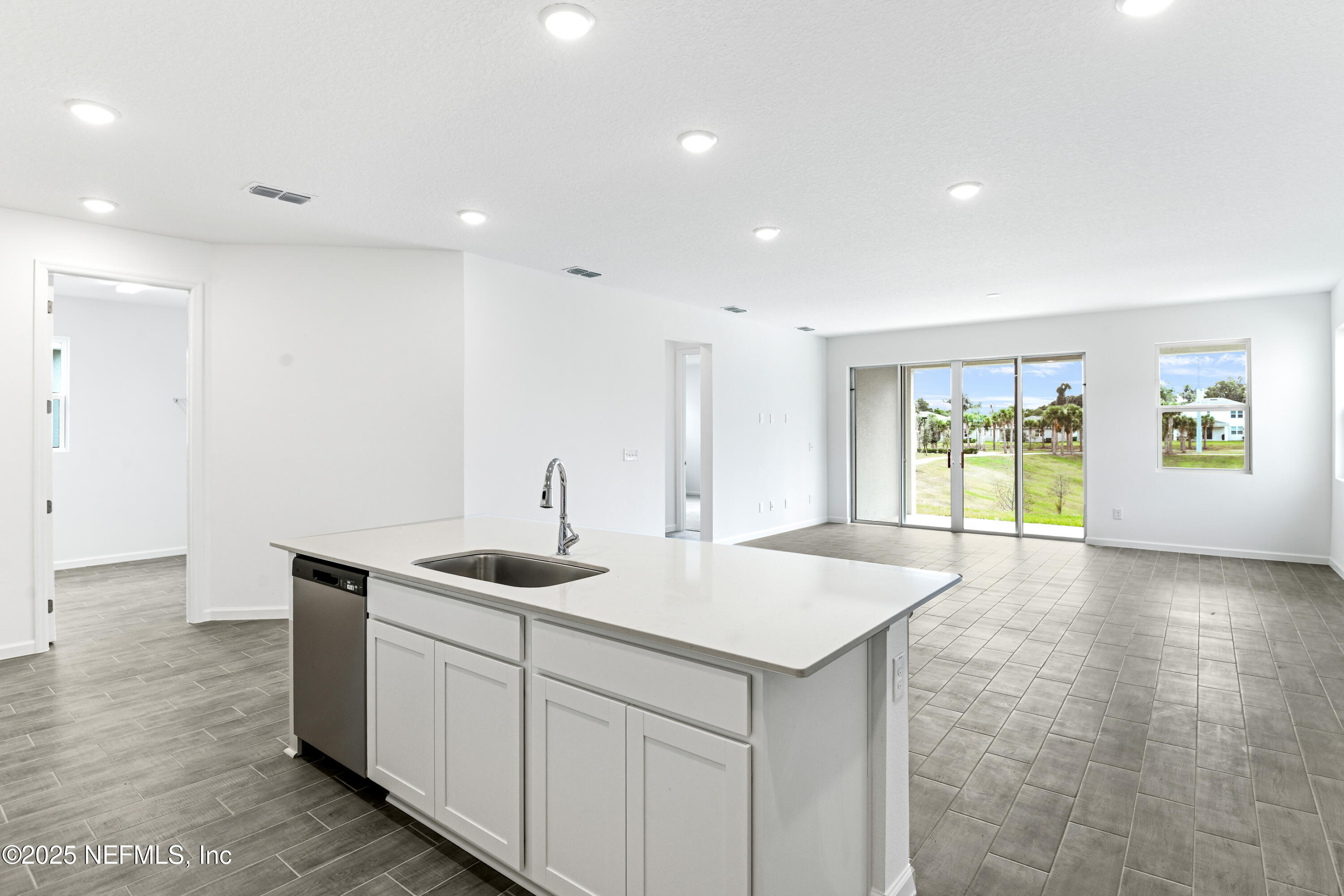 328 Alexandrite Street DeLand, FL 32720 - Photo 9 of 16 a kitchen with sink and window