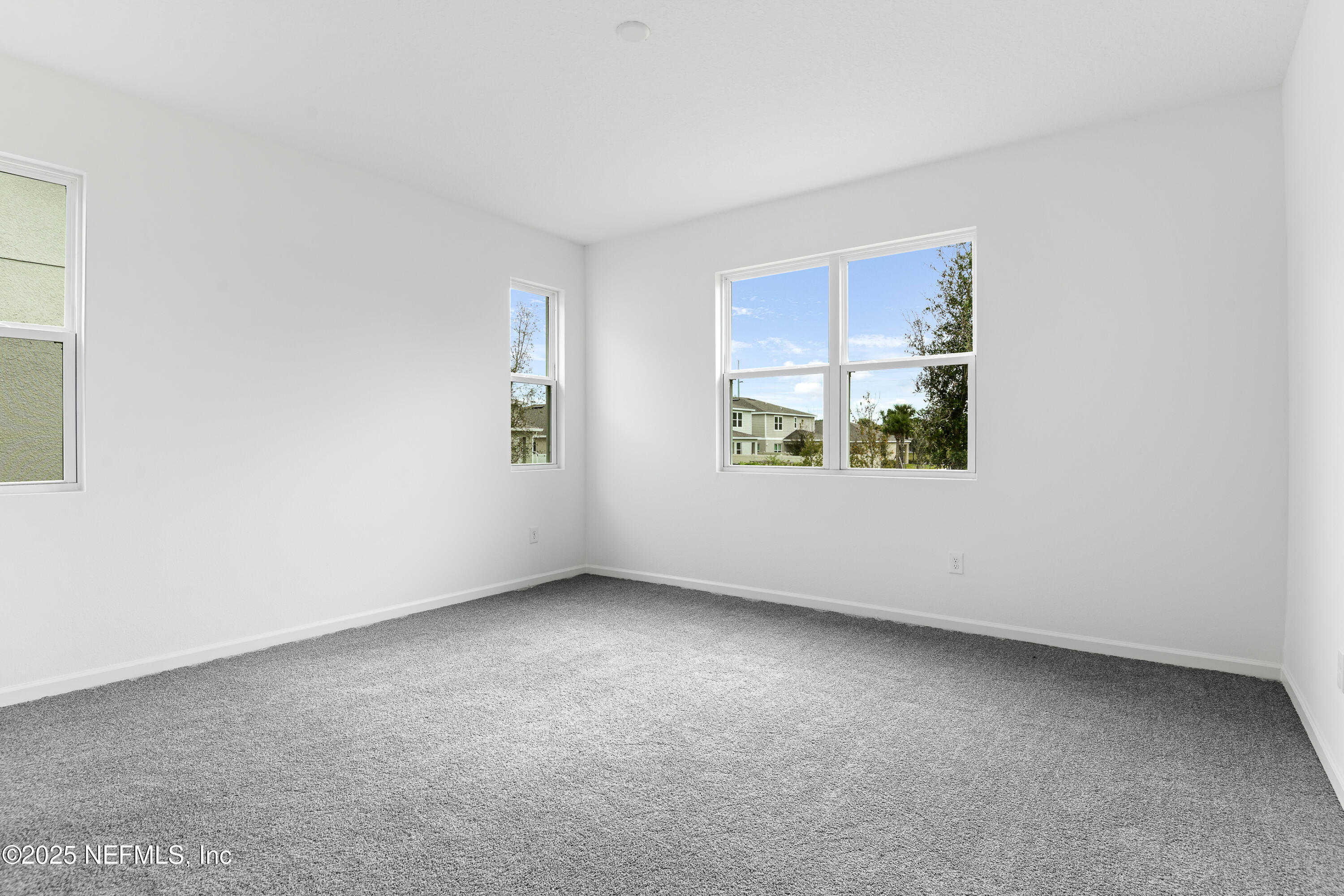 328 Alexandrite Street DeLand, FL 32720 - Photo 10 of 16 an empty room with windows
