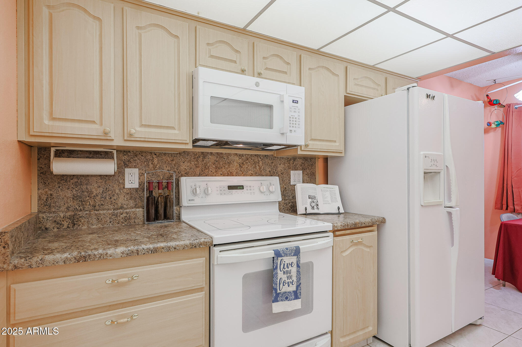 14022 North Palm Ridge Drive Sun City, AZ 85351 - Photo 4 of 21 a kitchen with granite countertop cabinets stainless steel appliances and a counter space