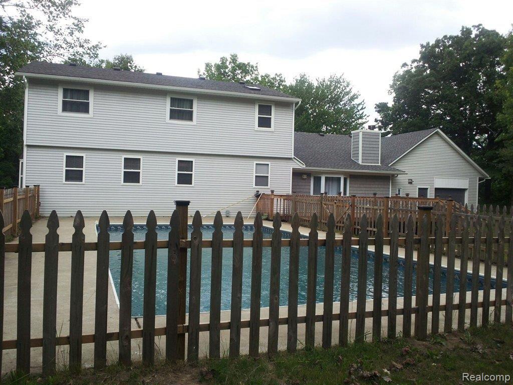 21431 Merriman Road New Boston, MI 48164 - Photo 4 of 22 merriman back of house.jpg