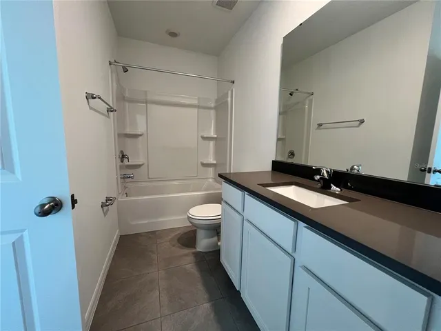 a view of a swimming pool with seating space