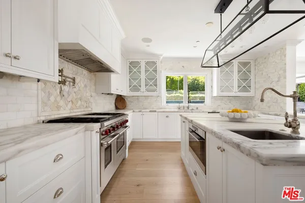 a utility room with sink dryer and washer