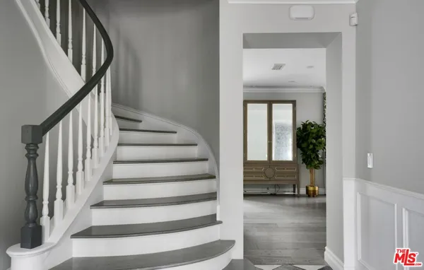 a view of entryway and hall with a rug
