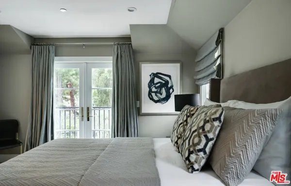 a bed room with a bed and a window