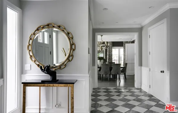 a view of hall way with furniture