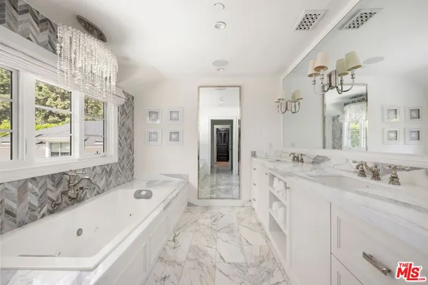 a kitchen with cabinets and window