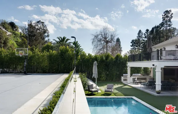 a view of swimming pool having outdoor seating
