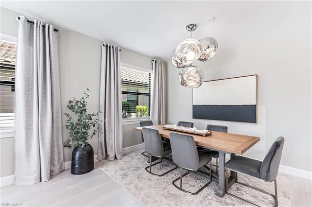 a kitchen with stainless steel appliances a refrigerator sink and cabinets