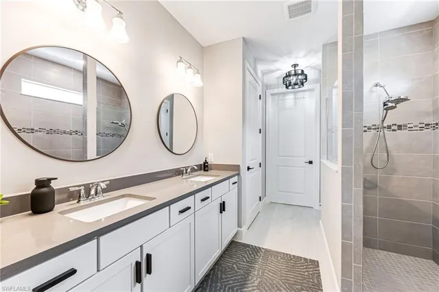 a room with a window and a chandelier