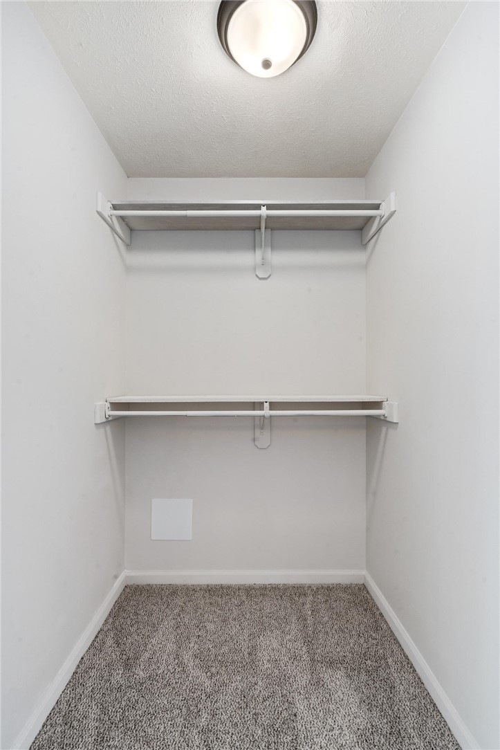 1353 Foust Road Xenia, OH 45385 - Photo 39 of 50 This practical closet provides ample storage with built-in shelving and hanging rods.