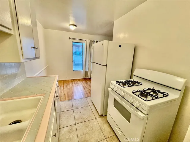 a view of a kitchen with wooden floor