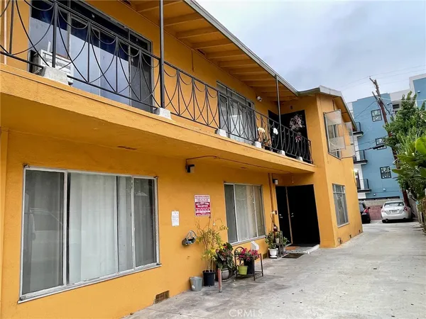 a view of a house with wooden stairs