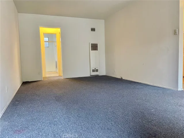 a view of empty room with floor to ceiling window