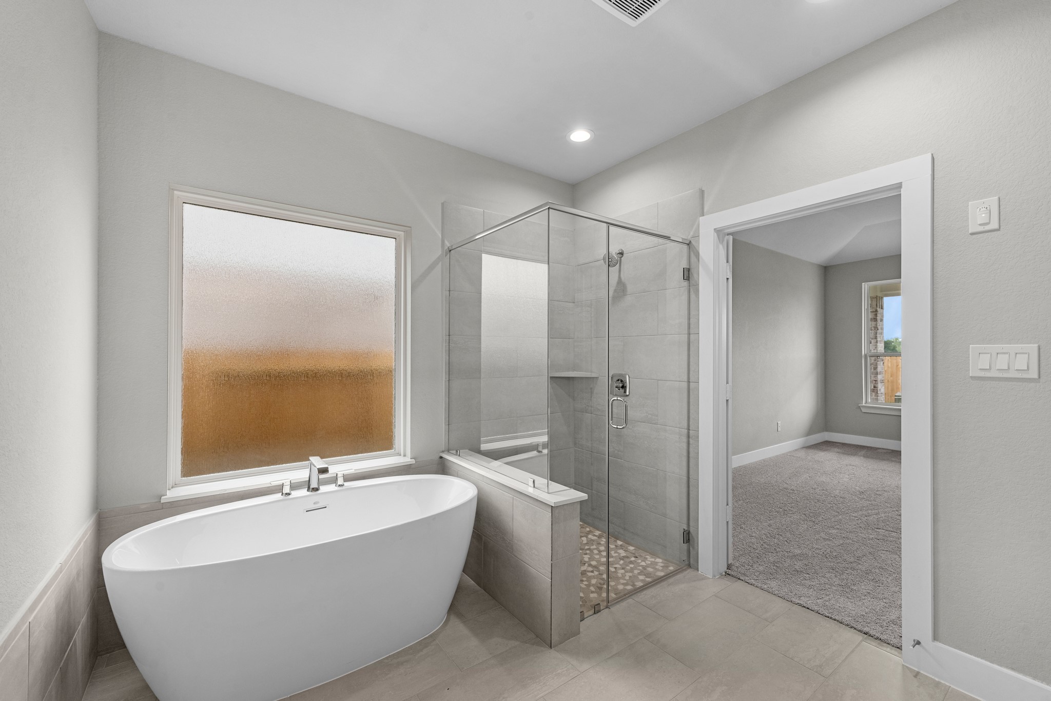 3410 Everglade Lane Rosenberg, TX 77471 - Photo 16 of 39 a bathroom with a bathtub and a shower
