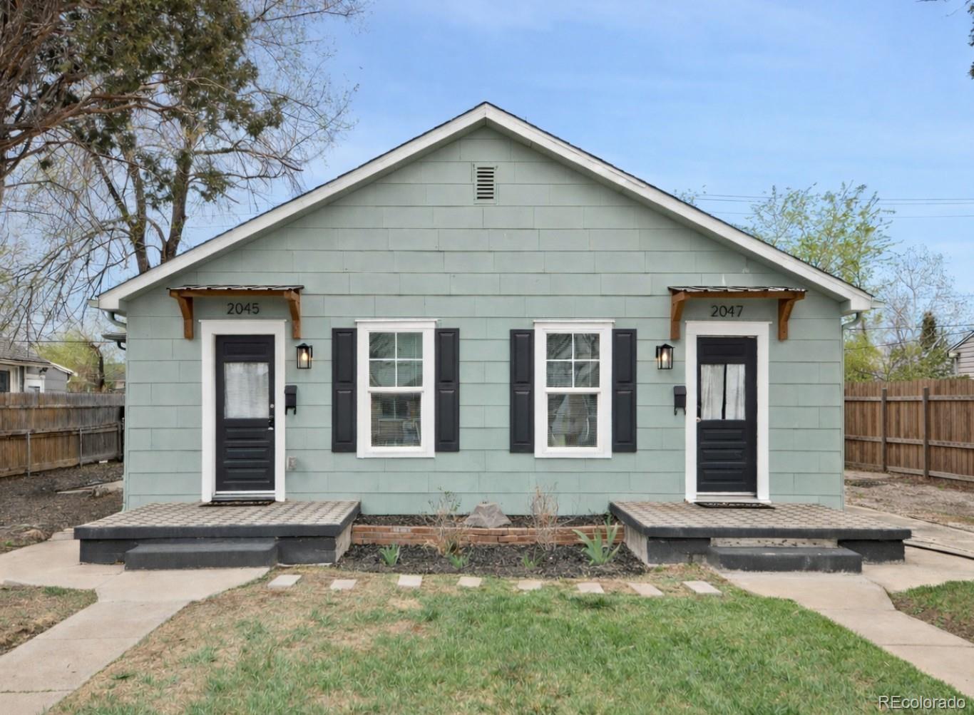 front view of a house with a yard