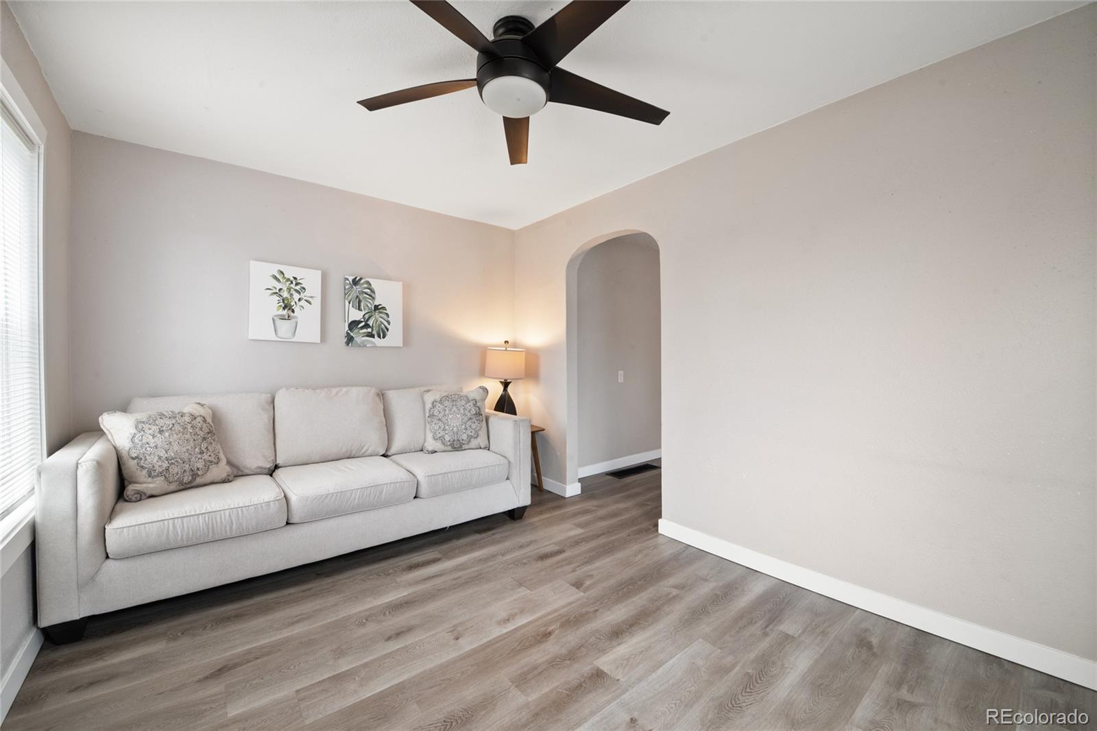 2045 Eaton Street Edgewater, CO 80214 - Photo 14 of 28 a living room with furniture and a ceiling fan