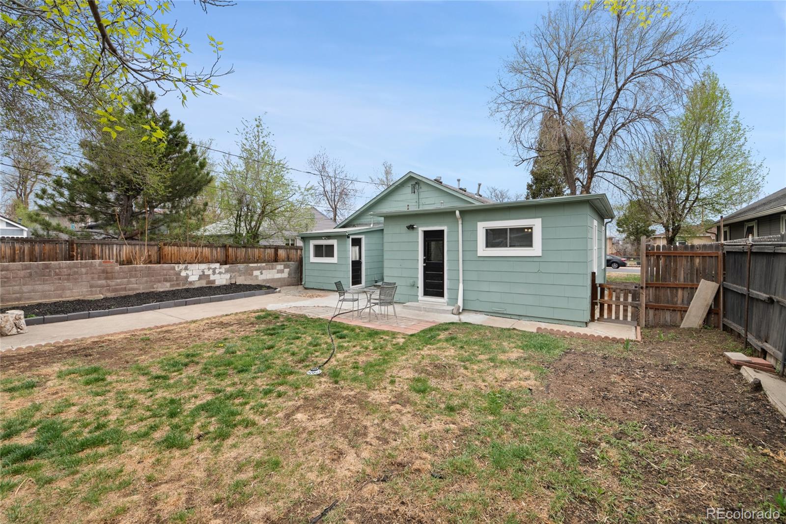 2045 Eaton Street Edgewater, CO 80214 - Photo 15 of 28 a view of a house with a yard and large tree