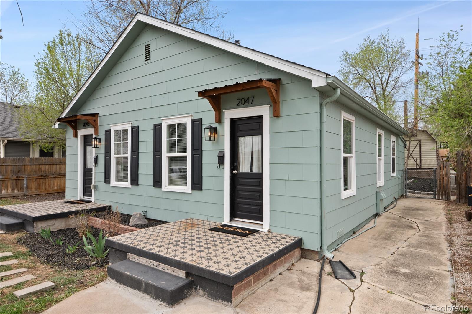 2045 Eaton Street Edgewater, CO 80214 - Photo 18 of 28 a front view of a house with garden