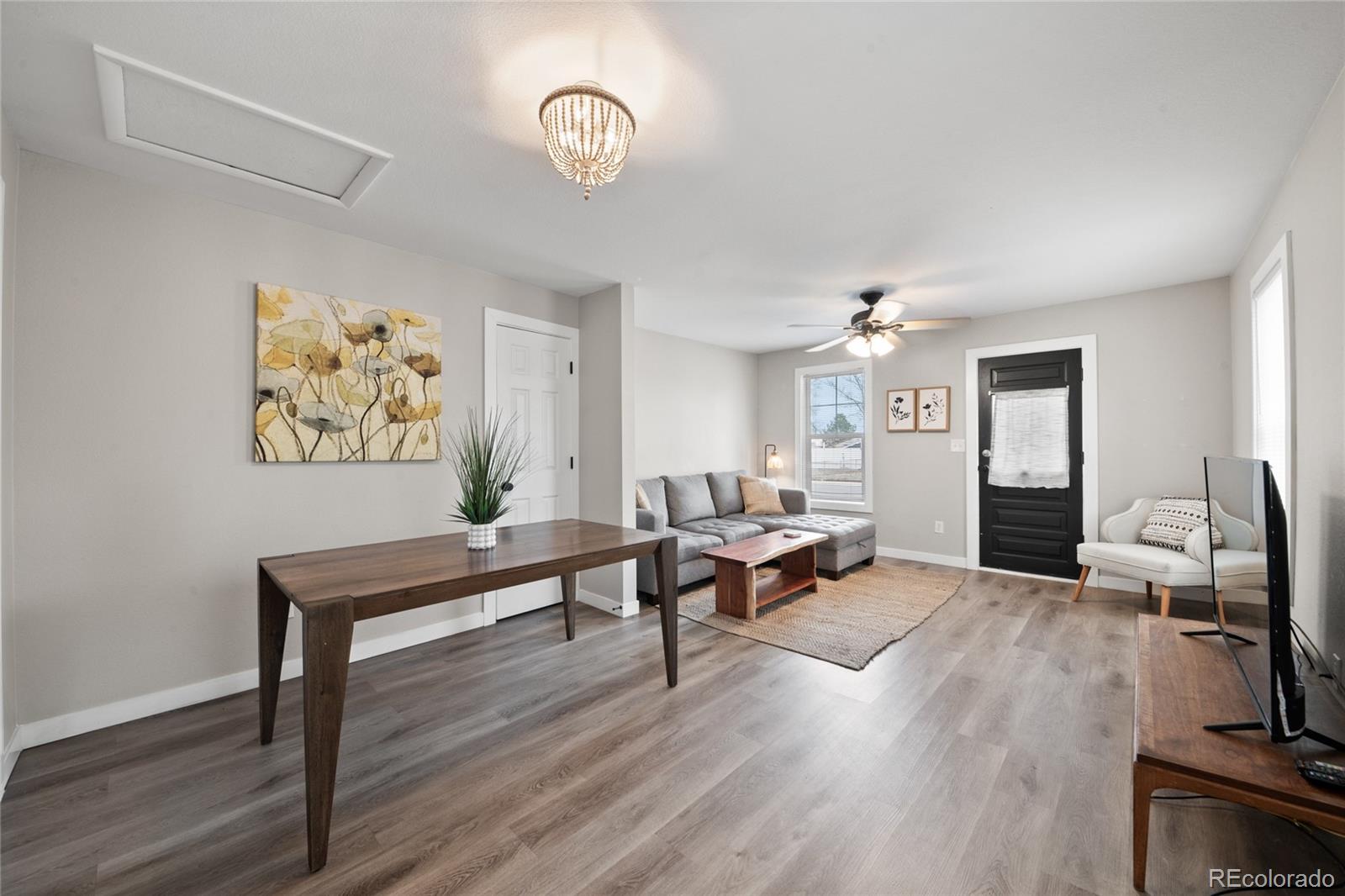 2045 Eaton Street Edgewater, CO 80214 - Photo 19 of 28 a living room with furniture and a wooden floor
