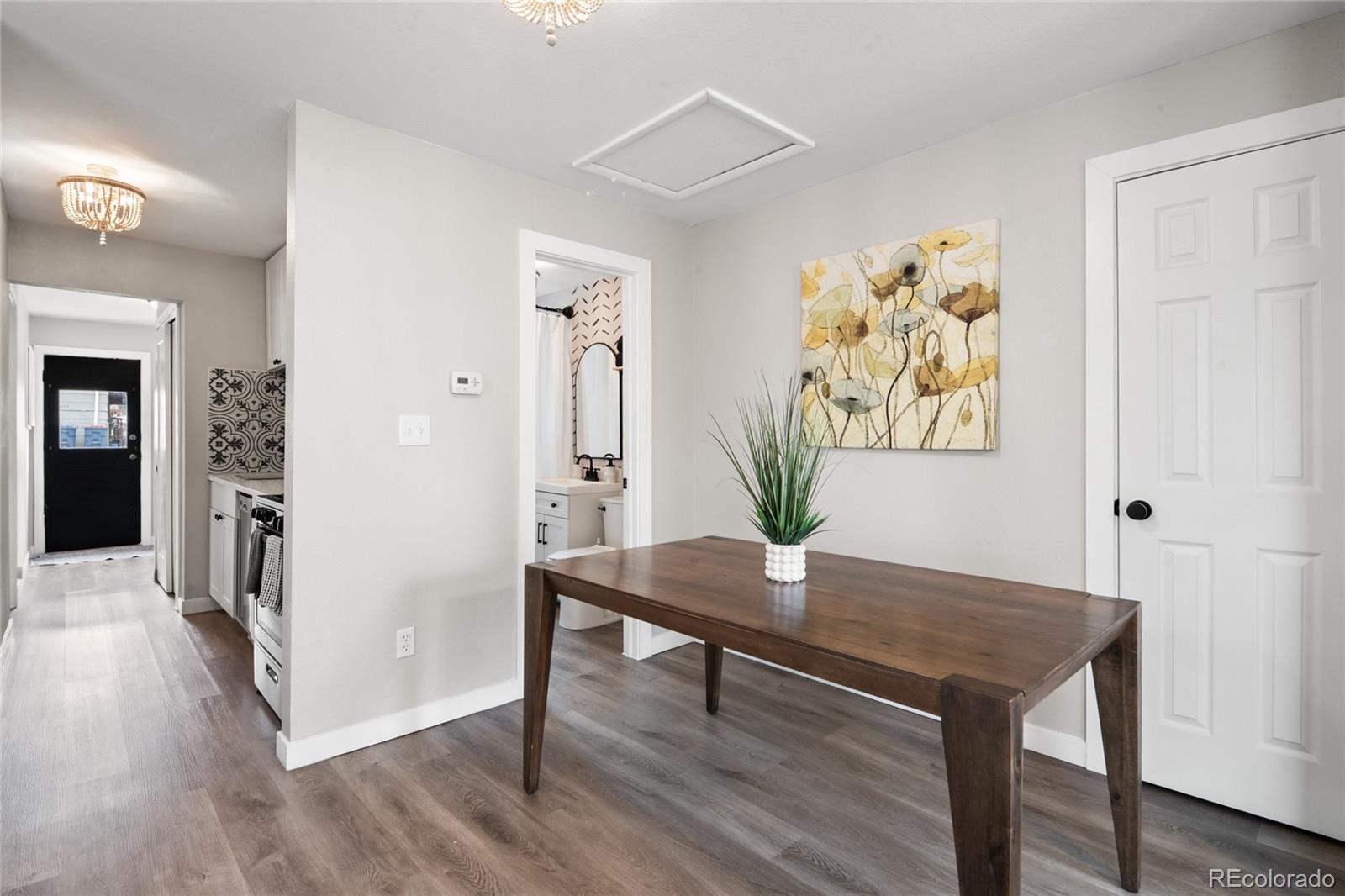 2045 Eaton Street Edgewater, CO 80214 - Photo 20 of 28 a view of a room with furniture and wooden floor