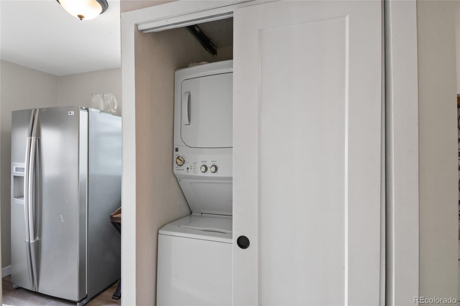 2045 Eaton Street Edgewater, CO 80214 - Photo 22 of 28 a close up of a storage and utility room with a washer and dryer