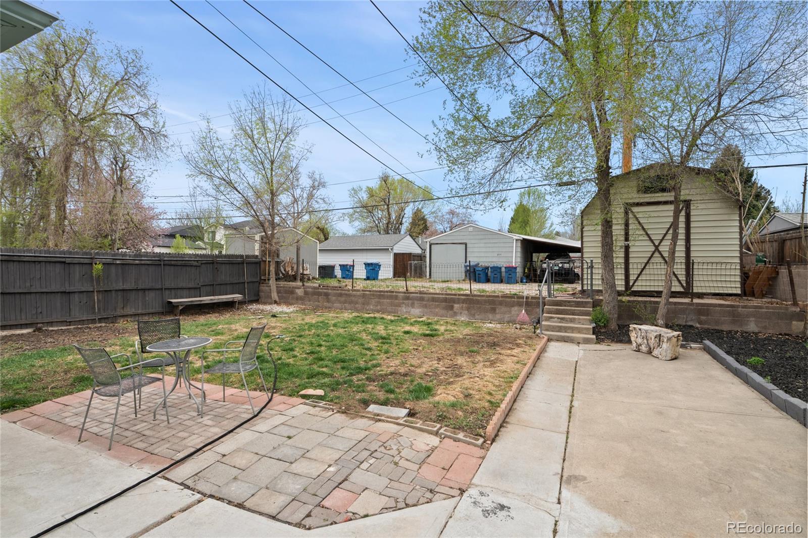 2045 Eaton Street Edgewater, CO 80214 - Photo 6 of 28 a view of a yard with plants and wooden fence