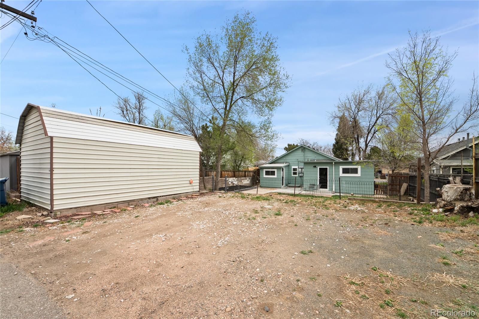 2045 Eaton Street Edgewater, CO 80214 - Photo 7 of 28 a view of a house with a snow in the yard