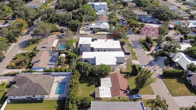 an aerial view of residential houses with outdoor space