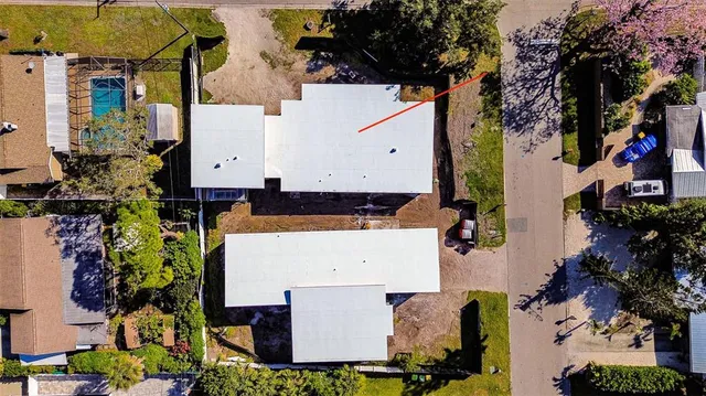 an aerial view of multiple house with outdoor space