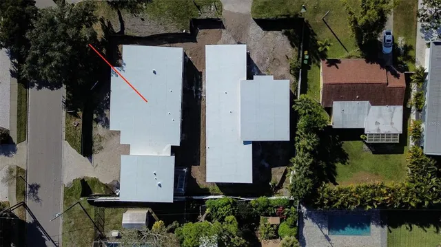 an aerial view of multiple house with outdoor space