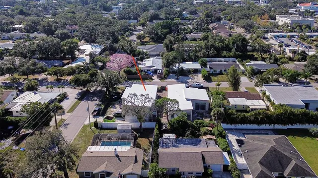 an aerial view of a houses with yard