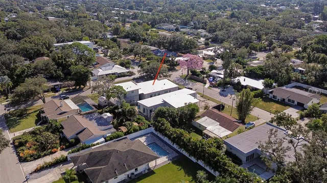an aerial view of residential houses with outdoor space