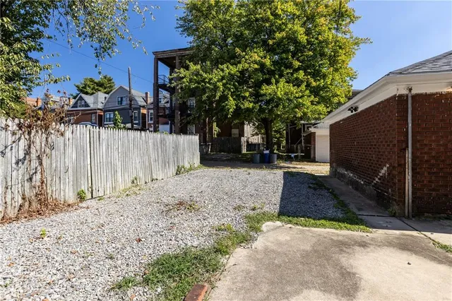 a view of a backyard of the house