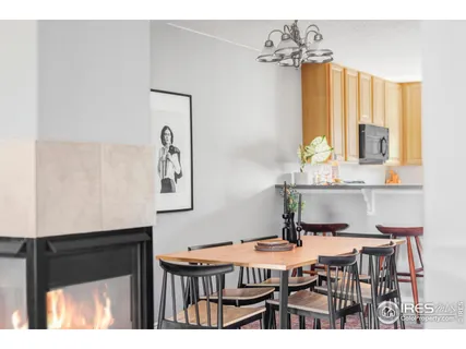 a dining room with a table chairs and a chandelier