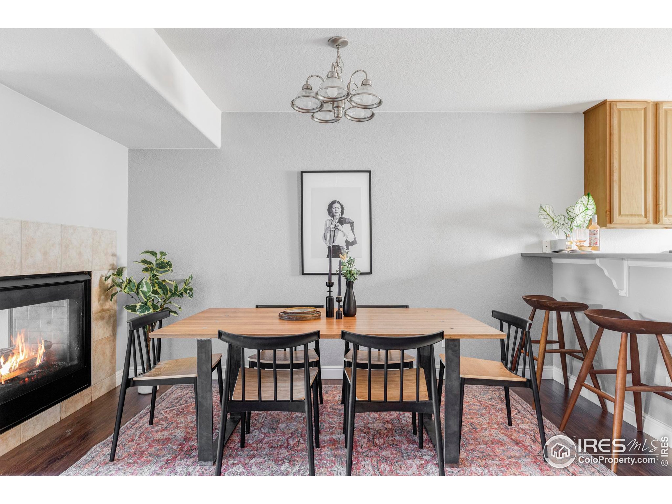 4240 Riley Drive Longmont, CO 80503 - Photo 13 of 25 a view of a dining room with furniture and chandelier